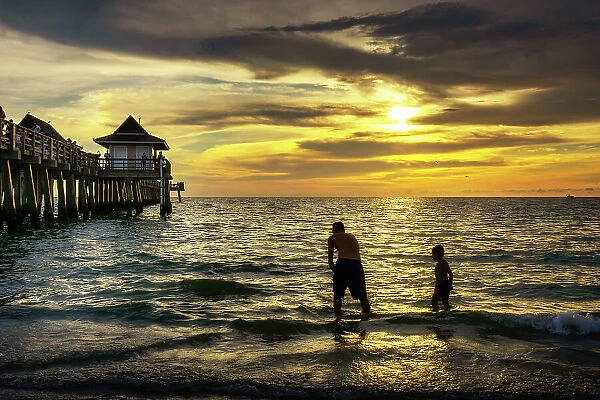 Florida, Naples, Fishing Pier, Playing on the beach