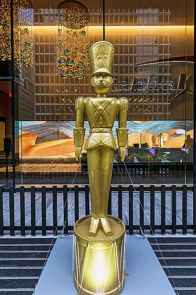NYC, Manhattan, Midtown, lobby, golden statue of toy soldier, Christmas