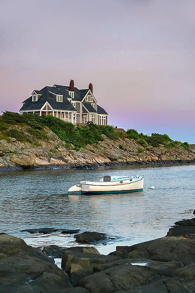 Rhode Island, Newport, boat on an inlet with upscale house in background