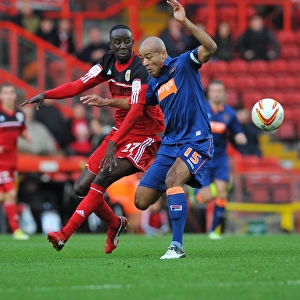 Adomah vs John-Baptiste: Intense Battle in Bristol City vs Blackpool Championship Match, 17/11/2012