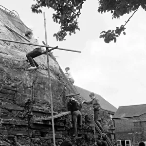 Boys build mountain at school, Seaford, East Sussex