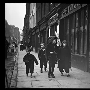 Four boys in a street in the East End of London
