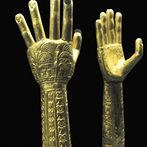 Ceremonial gold hands with embossed decoration