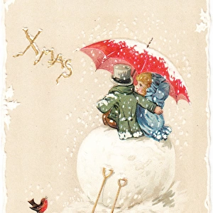 Two children sitting on large snowball on a Christmas card