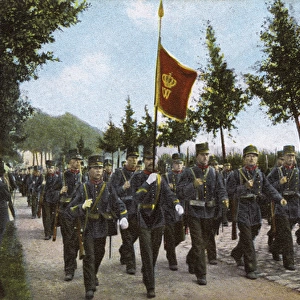 Dutch 7th Regiment marching along a street