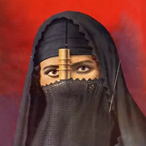 Egyptian woman in face veil with gilt cylinder, Egypt