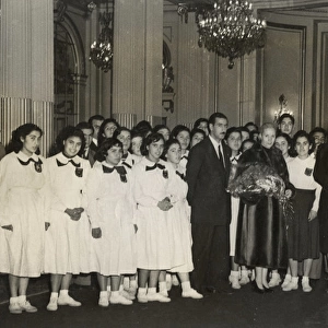 Eva Peron with delegation of teachers and students