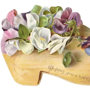 Flowers in a wooden clog-shaped Christmas card