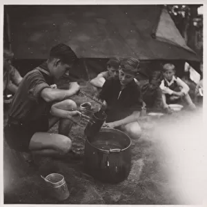 German boy scouts enjoying a meal at camp