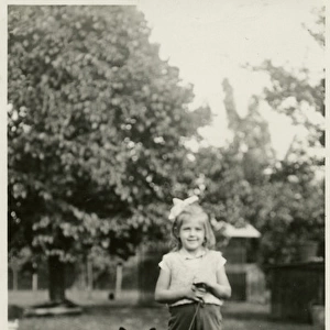 Girl in a park with her dog on a lead