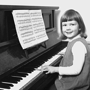 Little girl playing the Piano