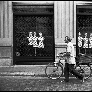 Man with bike shop front, Valencia, Spain