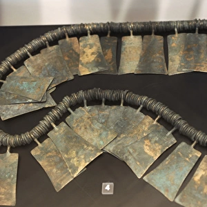Metal Age. Belt of many small bronze rings and ornamental pl