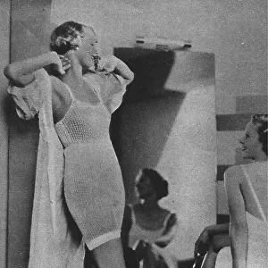 Models wearing fine knitted underear for evening wear Date: 1935