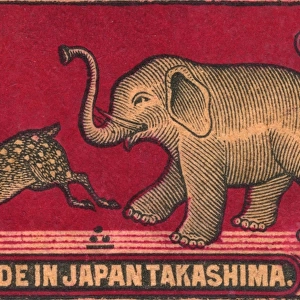 Old Japanese Matchbox label with an elephant chasing a deer