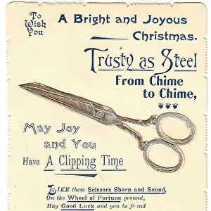 Pair of scissors with comic verse on a Christmas card