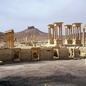 Palmyra, Syria - Tetrapylon with view of hilltop Arab Castle