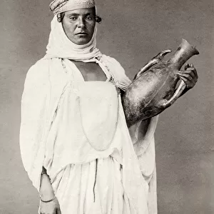 Portrait of a North African woman with a pot
