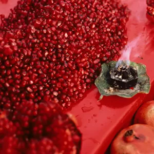 Red pomegranate seeds on display - market stall in Old Delhi