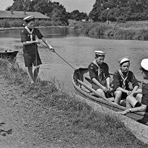 Sea scouts in a rowing boat