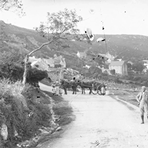 Village scene with people and horses in Mid or South Wales