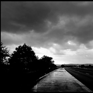 Wet road and stormy sky, UK