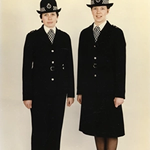 Two women police officers in new bowler hat, London