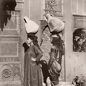 Women with pots carrying water, Egypt