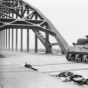 World War II - British tank crosses bridge Waal river