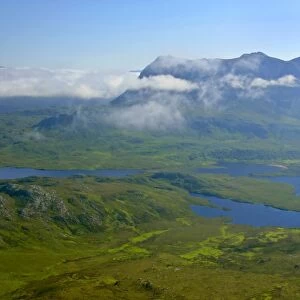 Inverpolly Nature Reserve view from Stac Pollaidh over Loch Sionascaig to Suilven with it's summit enveloped in dispersing clouds Inverpolly Nature Reserve, Wester Ross, Highlands, Scotland, UK