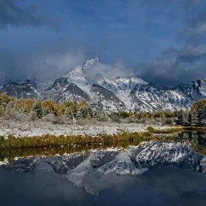 USA, Wyoming. Fall snow and reflection of Teton mountains, Grand Teton National Park Date: 05-10-2019