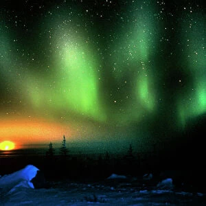 Aurora borealis display with setting Moon