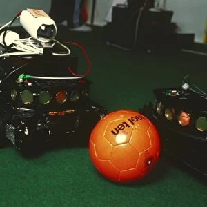 Two robots go for a ball at RoboCup-98 in Paris