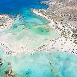 Aerial view of the equipped Elafonissi beach set in the unspoiled turquoise lagoon, Crete island, Greek Islands, Greece, Europe