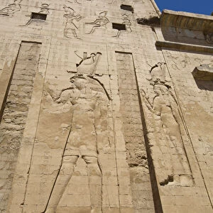 Bas Relief of God Horus on the left, First Pylon, Temple of Horus, Edfu, Egypt