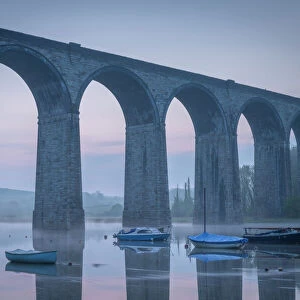 Boats beneath St. Germans Victorian viaduct at dawn, St. Germans in Cornwall, England, United Kingdom, Europe