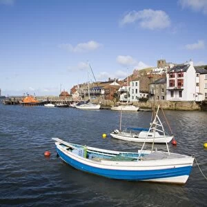 Boats in River Esk harbour and quayside buildings of old town, Whitby, Heritage Coast of North East England, North Yorkshire, England, United