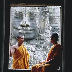 Buddhist monks at the Bayon temple, Angkor, UNESCO World Heritage Site
