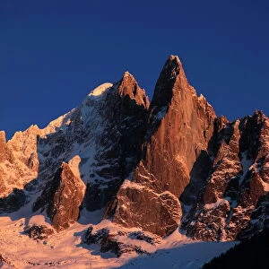 The celebrated peak of the Aiguille du Dru stands high above the village of Argentiere