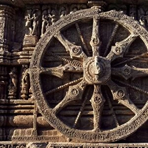 Close-up of carved chariot wheel