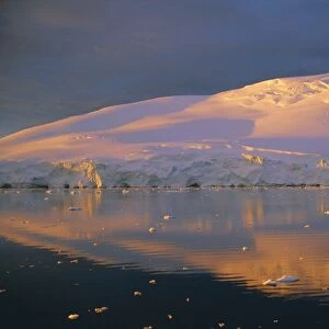 Coastal landscape lit by the midnight sun, Antarctic Peninsula, Antarctica