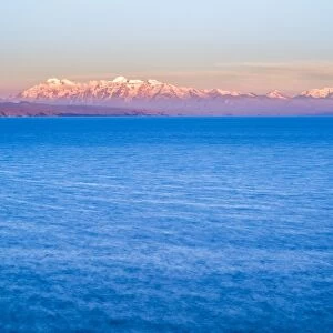 Cordillera Real Mountain Range, part of Andes Mountains, and Lake Titicaca at sunset