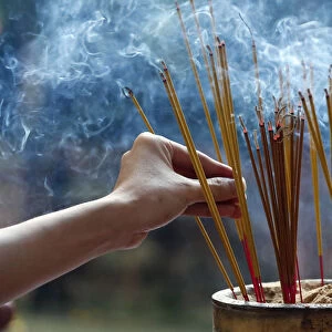 Emperor Jade pagoda (Chua Phuoc Hai), incense sticks on joss stick pot burning