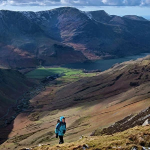 Female walker on Dale Head above Honister Pass and Buttermere Valley, Lake District National Park, UNESCO World Heritage Site, Cumbria, England, United Kingdom, Europe