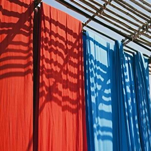 Freshly dyed fabric hanging to dry, Sari garment factory, Rajasthan, India, Asia