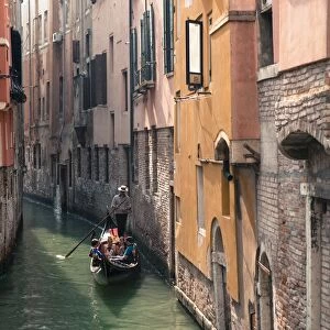 Gondola with tourists on a narrow canal, Venice, UNESCO World Heritage Site, Veneto, Italy, Europe