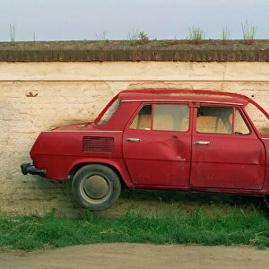 Half a Skoda on a wall in a car salesyard near Piestany