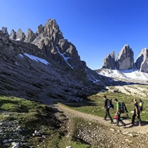 Hikers venturing to discover the Three Peaks of Lavaredo, Sesto, Dolomites, Trentino-Alto Adige