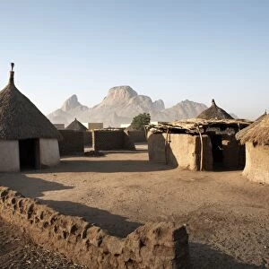 Homes lie in the shadow of Taka Mountain in the town of Kassala