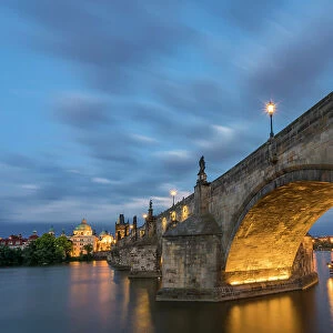 Illuminated arch of Charles Bridge at twilight, UNESCO World Heritage Site, Prague, Bohemia, Czech Republic (Czechia), Europe